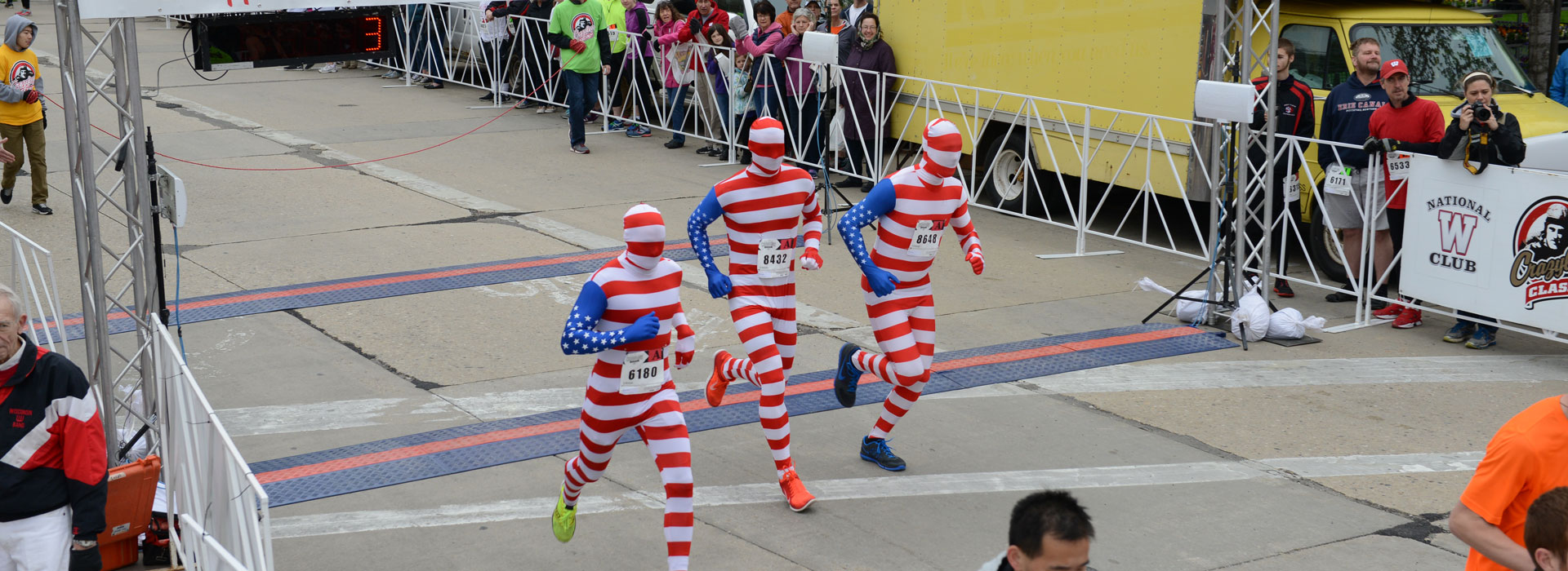 Start of the Race With 3 Runners Dressed in American Flag Spandex Costumes